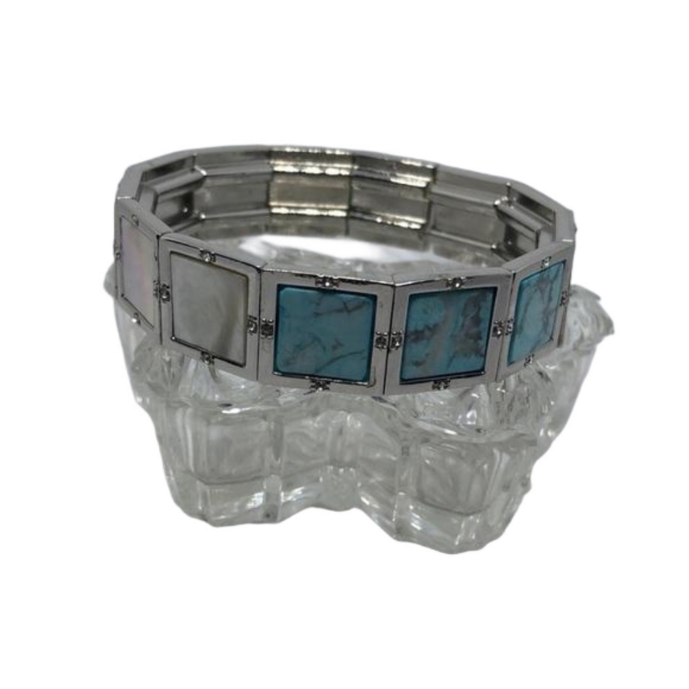 SILVER tone stretch stone and mop inlay bracelet with turquoise like stones.